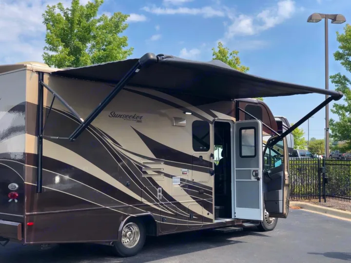 This Sunseeker RV rental, featuring an extended awning and open doors, is ready for your next adventure.. Forest River Sunseeker 2018
