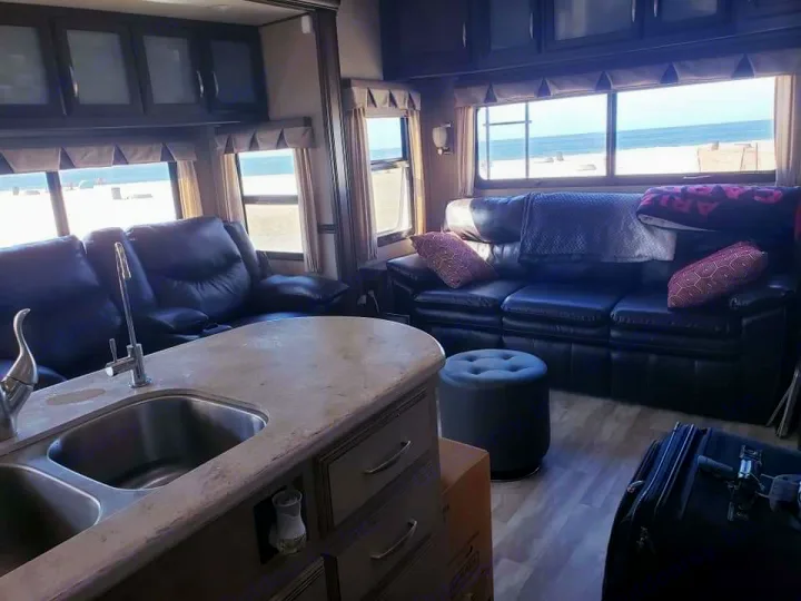 This RV rental offers a comfortable living space with stunning beach and ocean views, perfect for a seaside escape.. Grand Design Solitude 2016