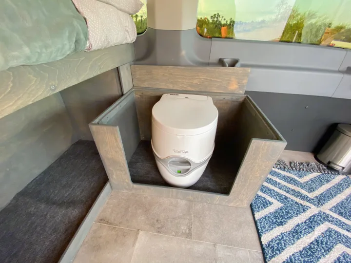 Porta Potti cassette toilet offers convenience and ease of use.. Ford Transit Camper Van 2017