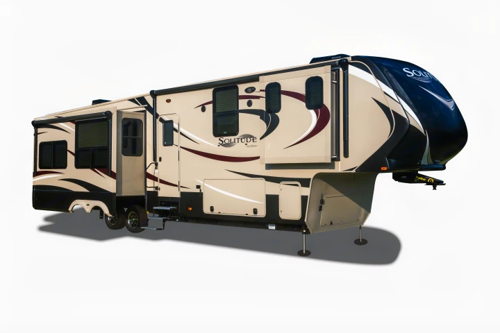 Spacious beige and black Solitude fifth-wheel RV for your next rv rental or camping trip, showcasing its expanded living area.. Grand Design Solitude 2016
