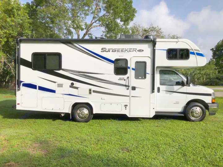 This white Sunseeker Class C RV rental, parked on lush green grass, is ready for your next adventure or camping trip.. Forest River sunseeker LE 2350 2020