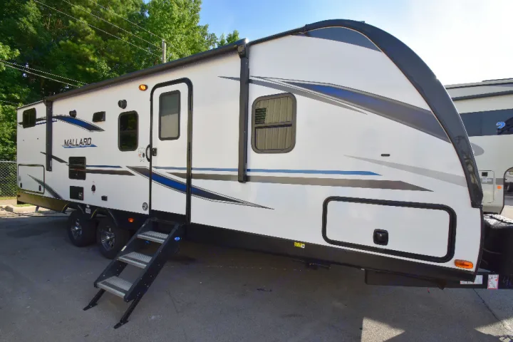 White Mallard travel trailer, an excellent RV rental option for camping and outdoor adventures.. Other Other 2020