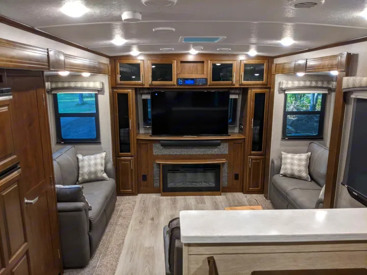 Comfortable RV rental living space with large TV, fireplace, and plush sofas for your next adventure.. Forest River Forest River Flagstaff Classic Super Lite 2021