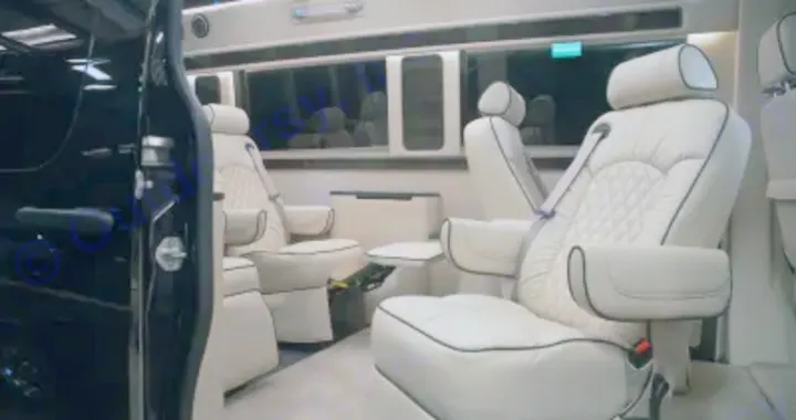 Experience luxury with this RV rental interior: spacious cream leather captain's chairs & diamond quilting.. Other Other 2020