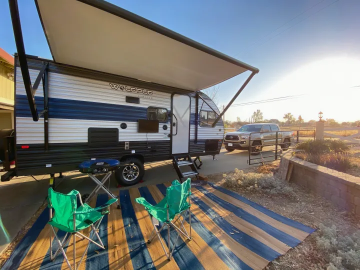 Experience outdoor living! An rv rental like this Wolf Pup travel trailer offers shade, comfy chairs, a grill, and relaxation.. Forest River Wolf Pup 2021