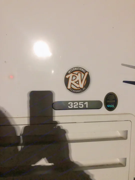 Close-up of an RV rental unit's side, showing unit number 3251 & an 'International RV Elkhart, IN' decal.. Forest River forester 2019