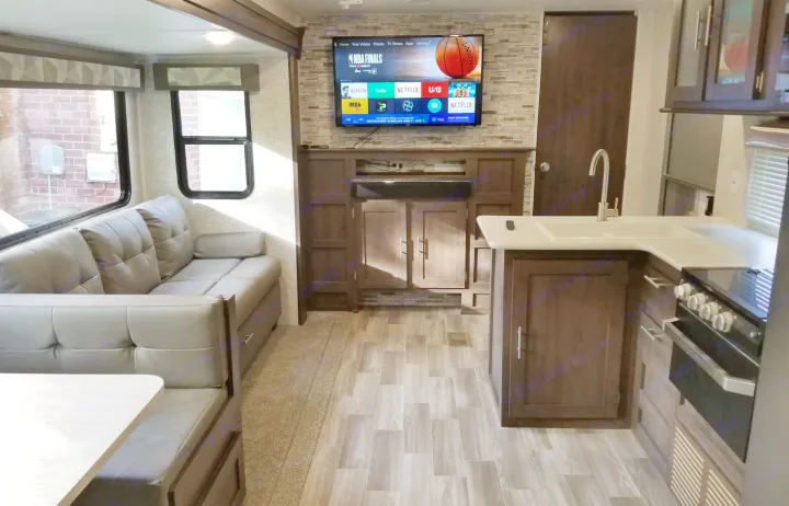 Comfortable RV rental interior with living area, smart TV, dinette, and full kitchen. Perfect for trips.. Forest River Salem 2019