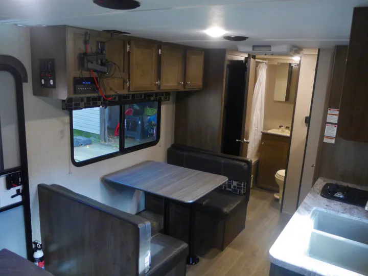 Cozy RV interior with dinette, kitchen, and bathroom. Perfect for your next RV rental adventure.. Coleman Other 2018