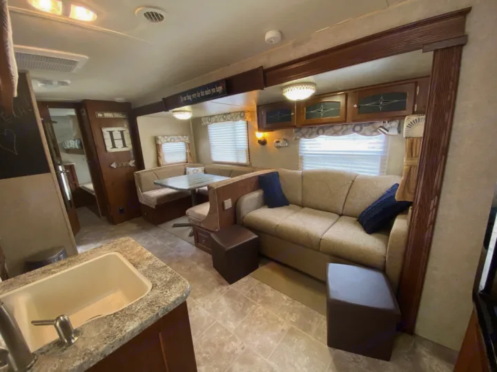 Living area with super comfy full size air mattress sleeper sofa. Forest River Rockwood Signature Ultra 2012