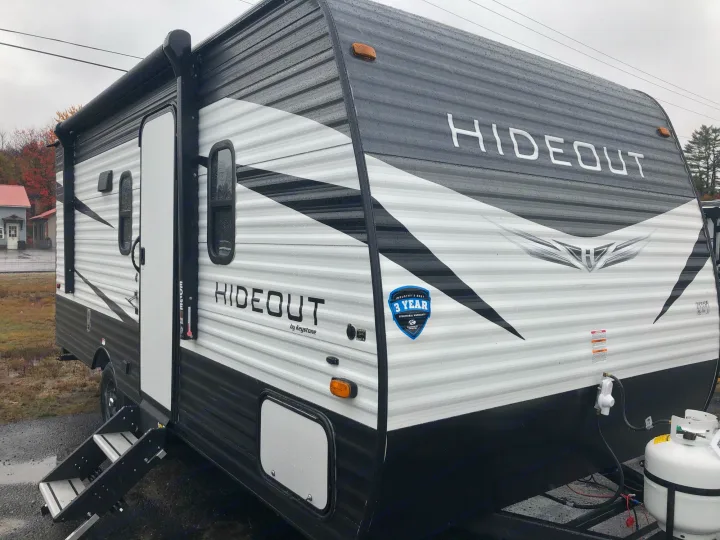 This Keystone Hideout travel trailer, a sleek grey and black RV, is perfect for your next rv rental and outdoor adventures.. Keystone Hideout 179LHS 2021
