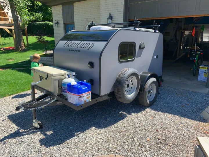 An UkanCamp travel trailer, equipped with camping gear, ready for an RV rental adventure.. Little Guy Other 2020