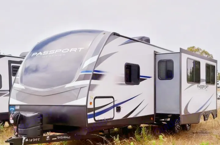 Modern Passport travel trailer, perfect for your next RV rental adventure. This spacious RV camper has a slide-out.. Keystone RV Passport GT 2021