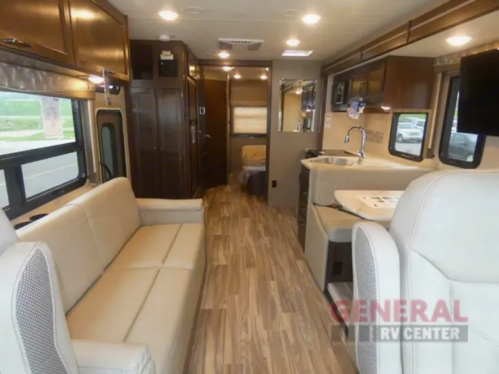 Explore this modern RV rental interior featuring a living area, dinette, kitchen, and a hallway leading to the rear.. Other A.C.E 2020