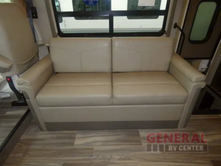 RV rental interior: light-colored sofa, wood-look floor, and large windows offer a cozy travel space.. Other A.C.E 2020