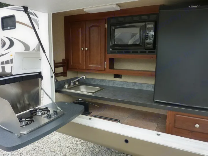 Amazing outdoor kitchen + attached propane grill not shown in pic. Forest River Rockwood Signature Ultra 2012