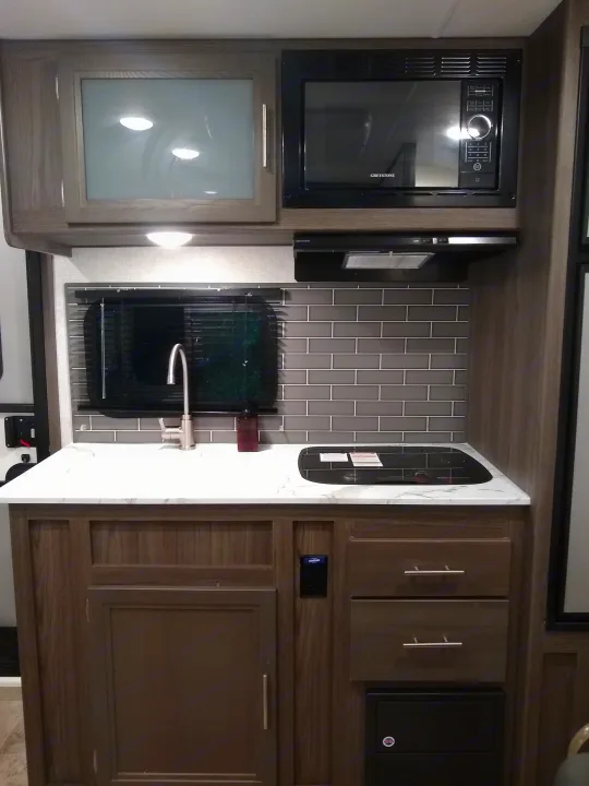 Fully-equipped kitchen! Microwave, large sink, large refrigerator, cooktop, storage. . Dutchmen Kodiak Cub 175BH 2021