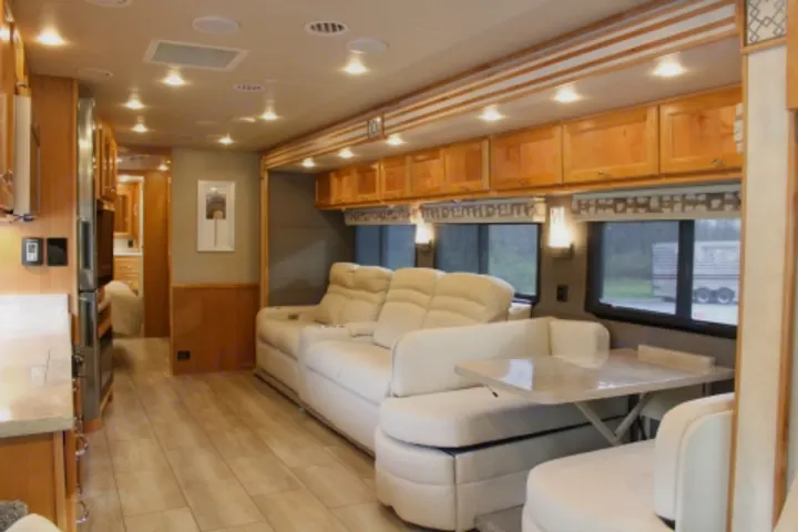 Luxury RV rental interior with spacious living, dining, and kitchen areas.. Tiffin Motorhomes Allegro Red 2021