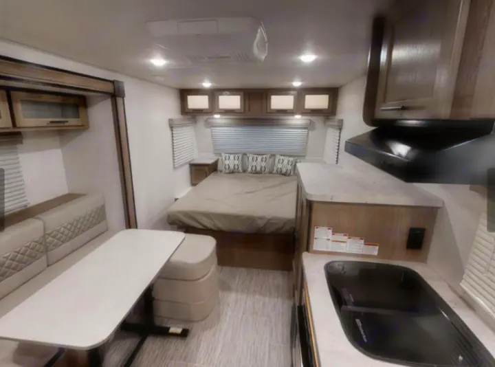 The bed has space and storage on each side. no climbing into this one from the end. The kitchen table also can convert into a small bed.. Forest River Other 2019