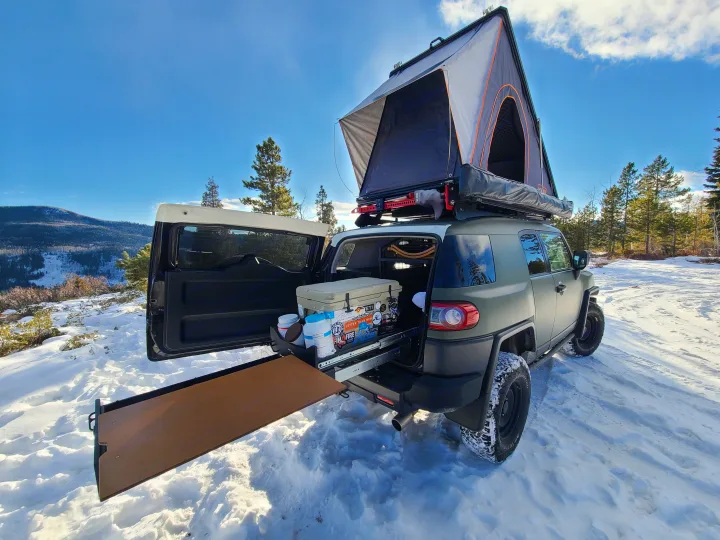 This vehicle has an integrated camp kitchen with storage draws and a slide-out cooler. A flip-up prep table is handy for quick convenient meals.. Toyota Landcruiser Poptop 2014