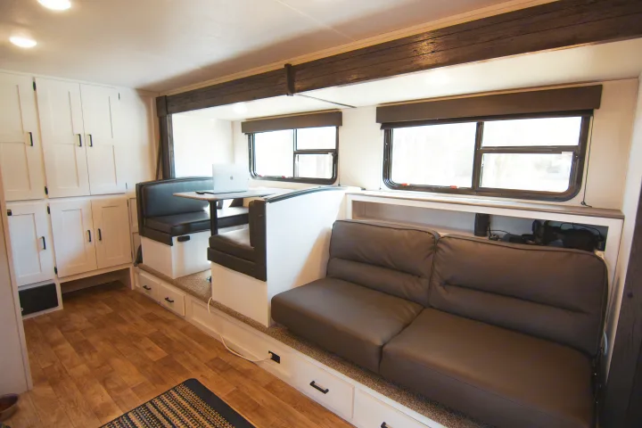Inside this modern RV rental, find a comfy dinette, sofa, ample storage cabinets, & bright windows.. Keystone RV Hideout 2021