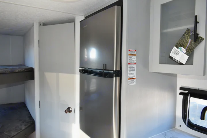 Step inside this cozy RV rental! Bunk beds, modern fridge, and kitchen space make for perfect family adventures.. Forest River Salem 2021