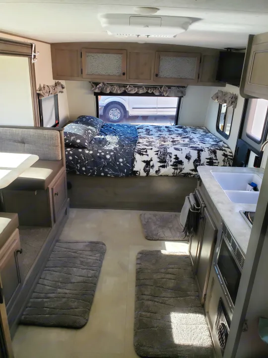queen bed with 4 inch memory foam topper. Coachmen Apex 2021