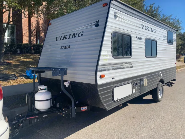 Exterior front with access to storage located under master bed . Coachmen Viking 2019