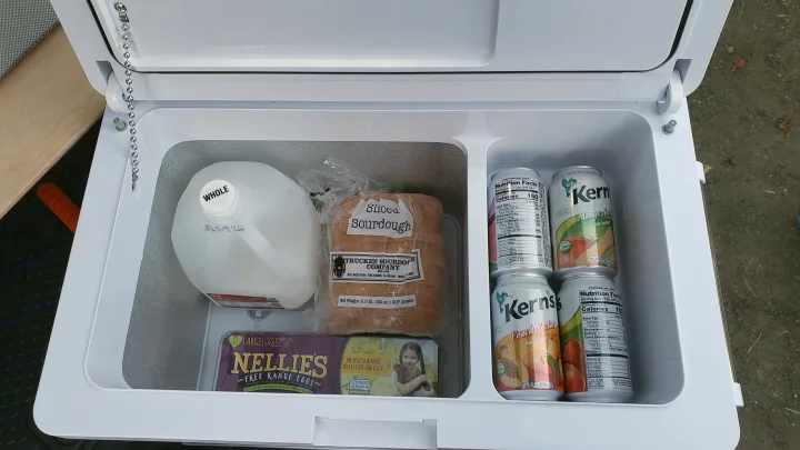 Fully stocked RV rental cooler with milk, sourdough bread, Nellie's eggs, and Kern's fruit nectar.. Honda Element 2003