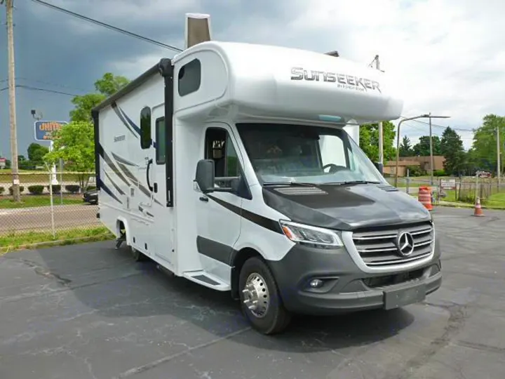Modern white Sunseeker RV rental on a Mercedes-Benz chassis, parked outdoors, perfect for your next journey.. Forest River Sunseeker 2020