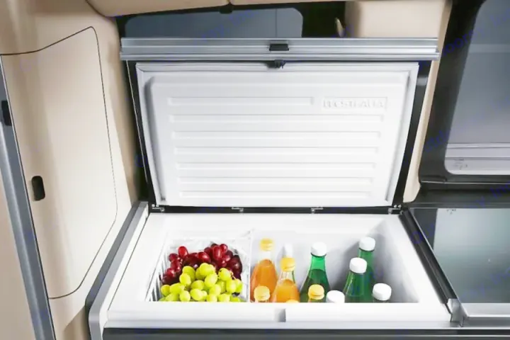 An RV rental's Westfalia fridge, stocked with fresh grapes and drinks, ready for your adventures.. Mercedes Marco Polo Class V 250d 2022