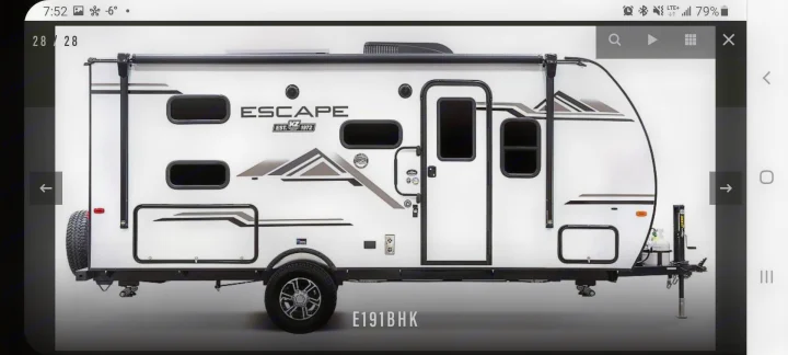 Side view of a white Escape E191BHK travel trailer, a perfect option for an RV rental.. K-Z Manufacturing Escape 191bhk 2021