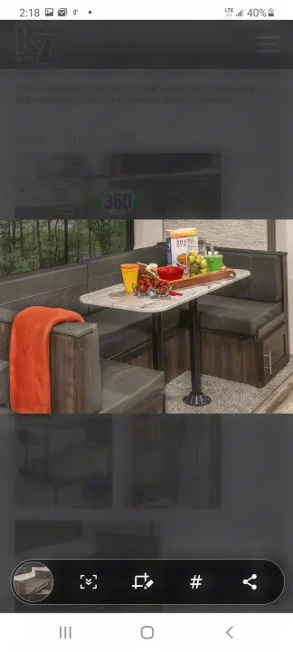 This rv rental shows a cozy travel trailer interior with a dinette, offering a comfortable living space for your adventures.. Other Sportsmen 2019