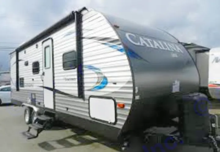 A silver and black Catalina travel trailer, an ideal RV rental for your next camping or road trip adventure.. Catalina 221TBS 2018