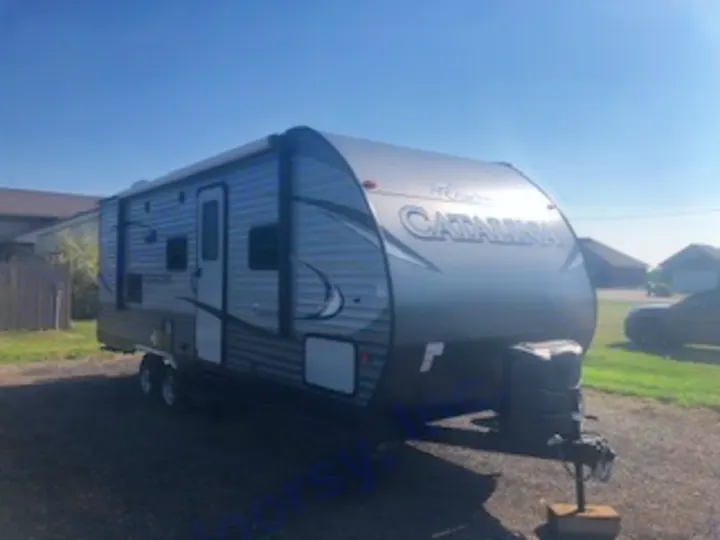 Silver Catalina travel trailer, ready for your next RV rental adventure, parked outdoors on a sunny day.. Catalina 221TBS 2018