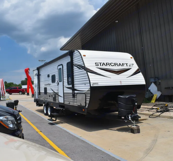 A white & black Starcraft travel trailer, perfect for your next RV rental. Ready for camping adventures!. Starcraft Autumn Ridge 2020