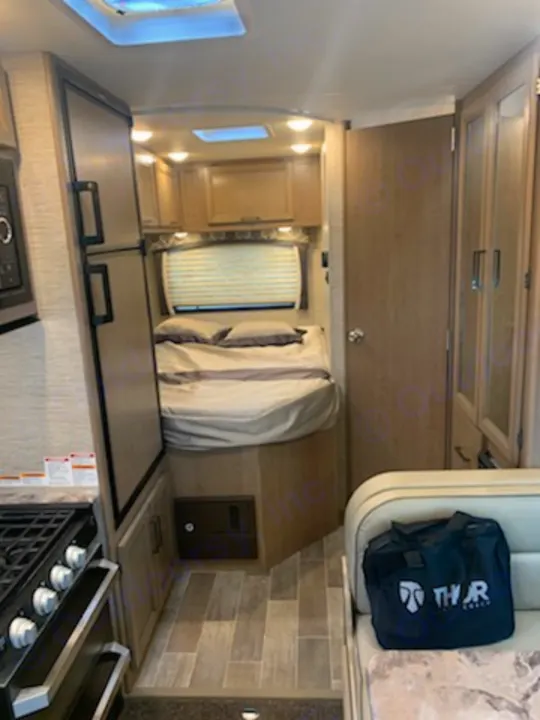 Main bed has curtains for ultimate privacy, and cabinets on top for extra storage. Thor Motor Coach Chateau 2021