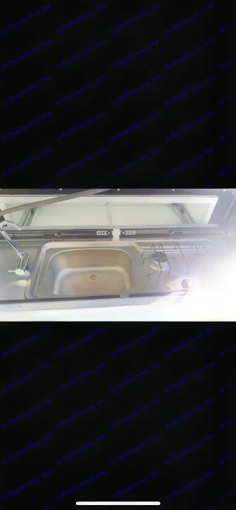 RV rental features a compact kitchen with a stainless steel sink and a two-burner stove.. Mercedes Metris 2016
