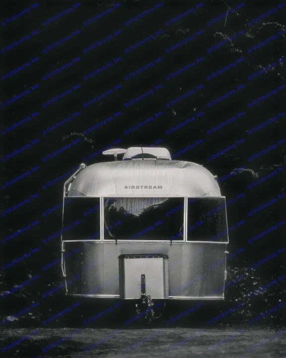 This low-key, front view highlights a classic silver Airstream travel trailer, perfect for your next rv rental camping adventure.. Airstream Globetrotter 2020