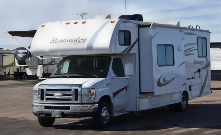 This white Class C Sunseeker motorhome, with its slide-out extended, is ready as an rv rental for your next road trip.. Forest River Sunseeker 2015