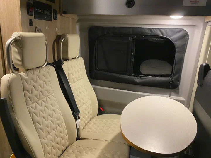 This is the place where two passengers can sit and a table. Winnebago Other 2021