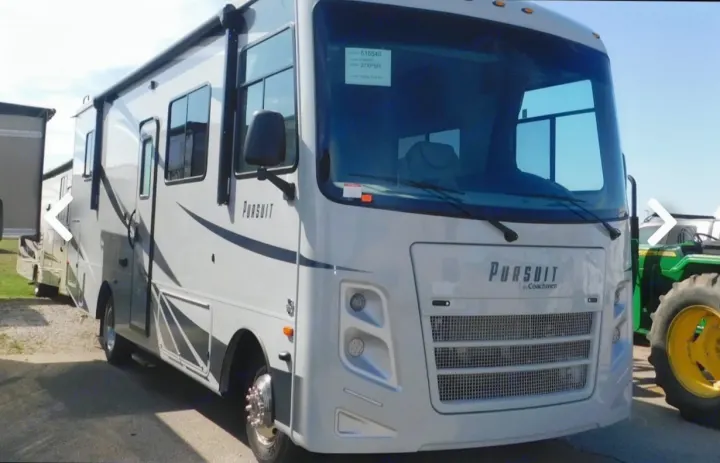 Sleek white Coachmen Pursuit RV. Ideal for your next RV rental adventure.. Coachmen Pursuit 2021