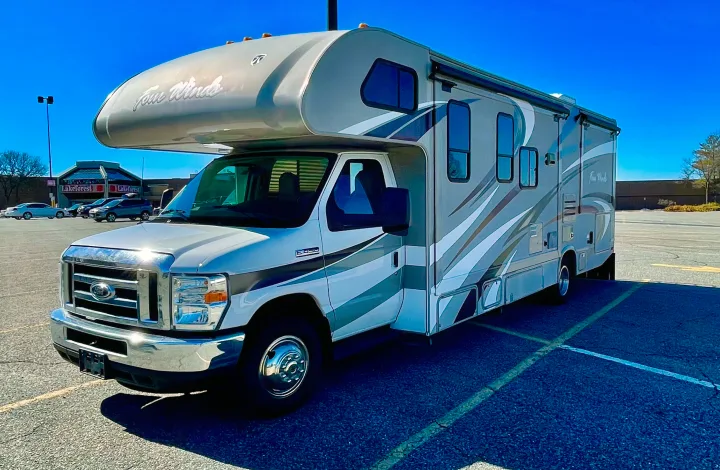 This Four Winds Ford RV rental is parked in a sunny lot. Its modern design and spacious look are ready for travel.. Other Four Winds 2016