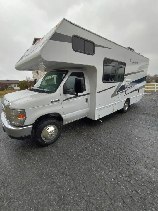 White Ford E-450 Class C RV rental, a Wayfarer motorhome, ready for adventure on an overcast day.. Tiffin Motorhomes wayfarer 2020