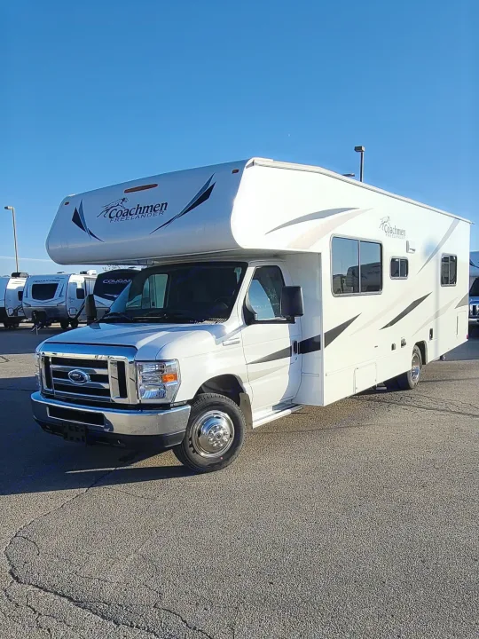 Experience freedom! Bright white Coachmen Freelander Class C motorhome, ready for RV rental adventures under a clear sky.. Coachmen Freelander 2021