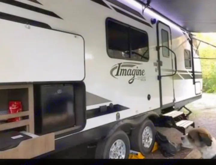 This Imagine RV rental offers an outdoor kitchen and awning, perfect for camping trips with your dog!. Grand Design Imagine 23 BHE 2021
