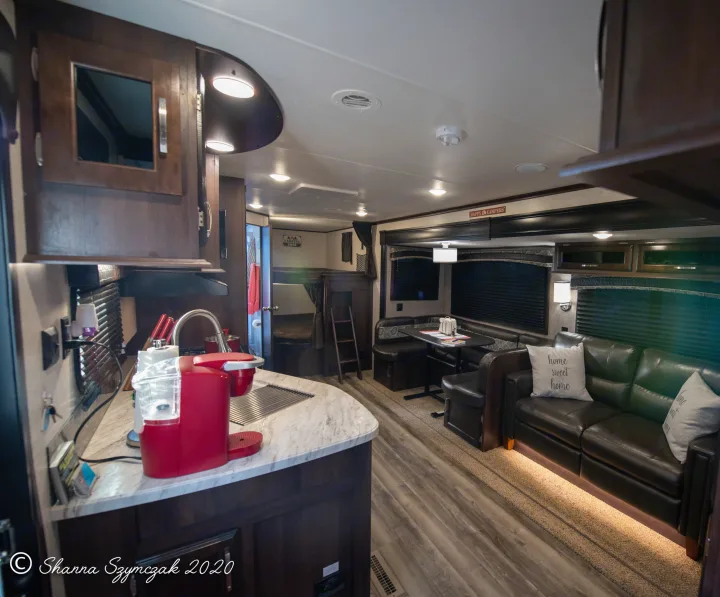 Step inside this inviting RV rental! Features a full kitchen, living area with sofa, dining booth, and comfy bunk beds.. Jayco Bunkhouse 2020