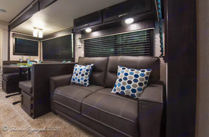 Explore this inviting RV rental living space, complete with a cozy sofa, dinette, and overhead storage.. Jayco Jay Flight 2021
