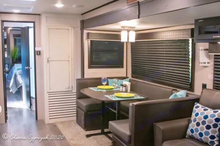 Step inside this modern RV rental! View of the comfortable dining area, sleek living space, and hallway leading to a private bedroom.. Jayco Jay Flight 2021