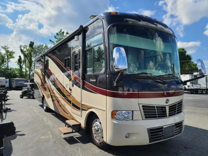 Automatic stairs are newer than those shown.  Has power awning and outdoor entertainment center.. Monaco Monarch 2012