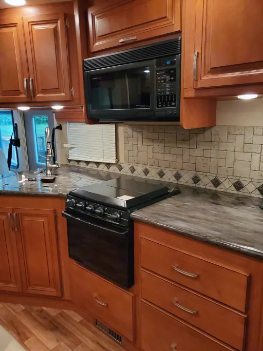 Gas stove and oven and microwave/convection oven. Monaco Monarch 2012